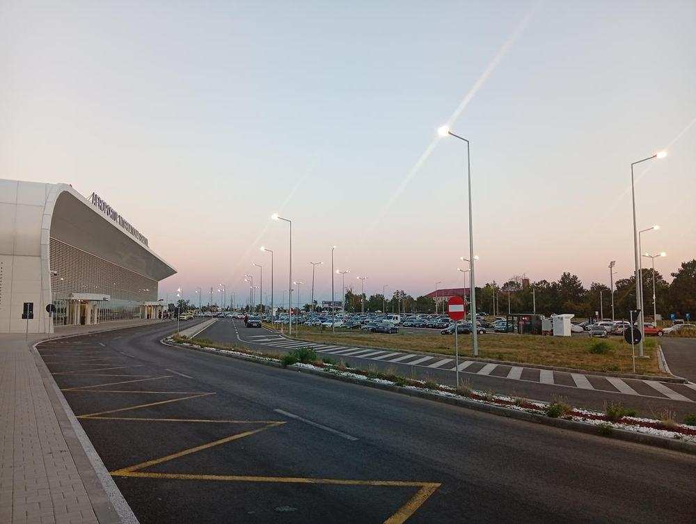 The terminal at dusk, car park in front