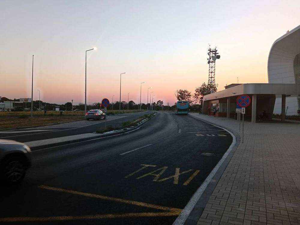 Taxi and bus lanes; line 9 stops under the canopy