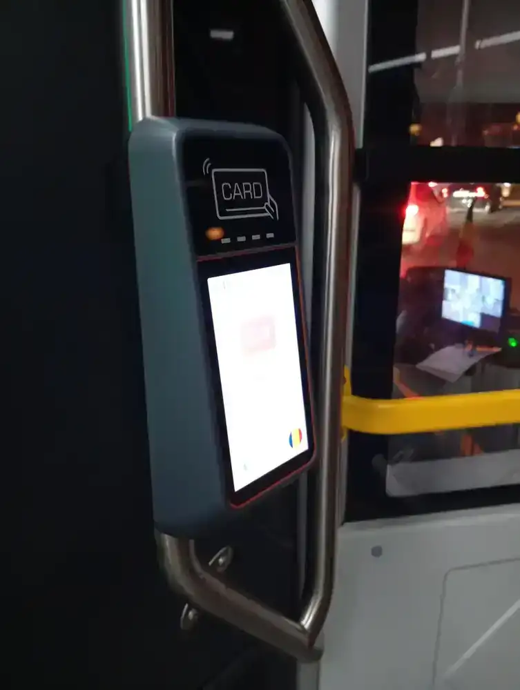 The card reader at the door on line E1R — the screen shows the line and the next stop