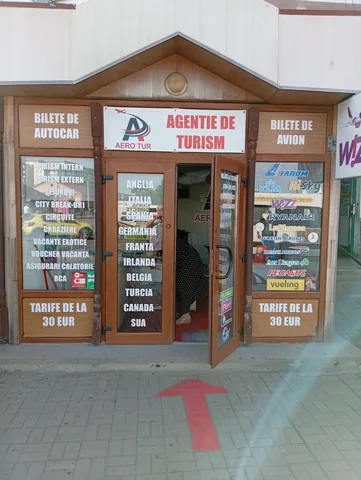 Aero Tur travel agency at Craiova North Bus Station selling coach and plane tickets, airline logos in the window, fares from 30 EUR, 13 August 2026