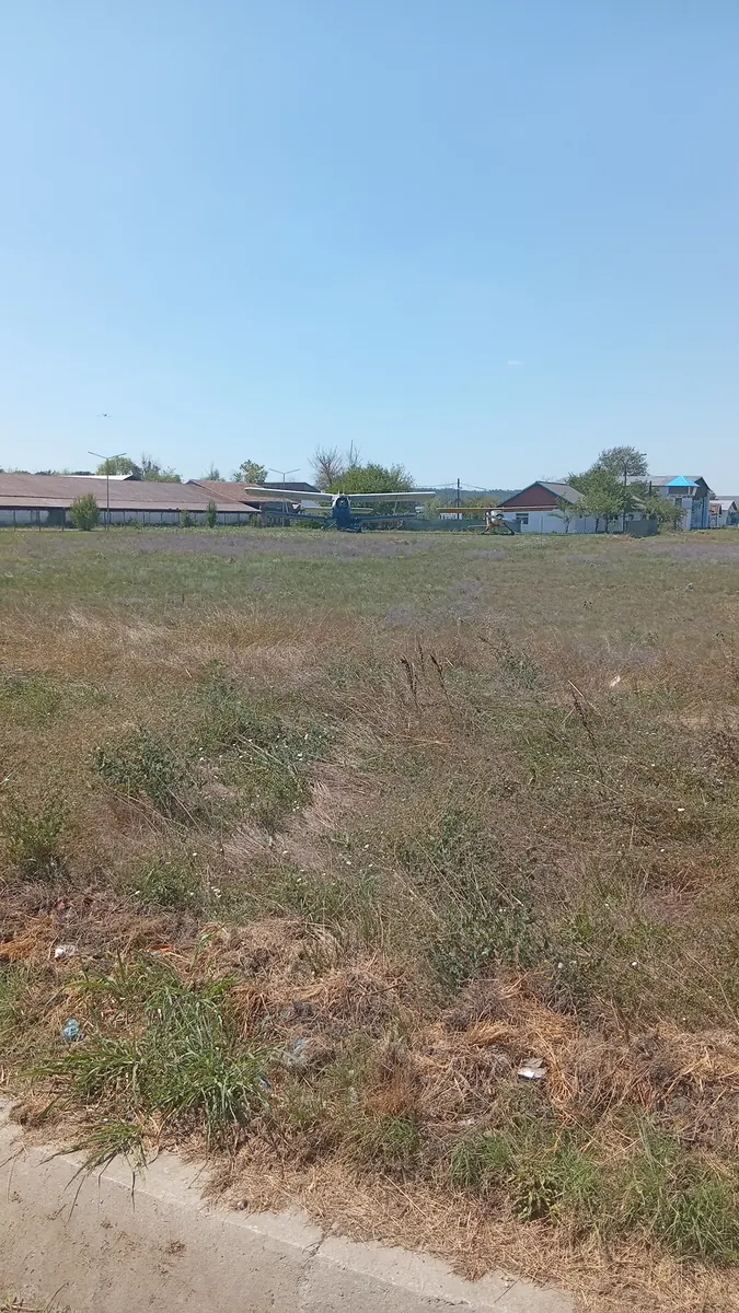 Aircraft parked in front of the hangars