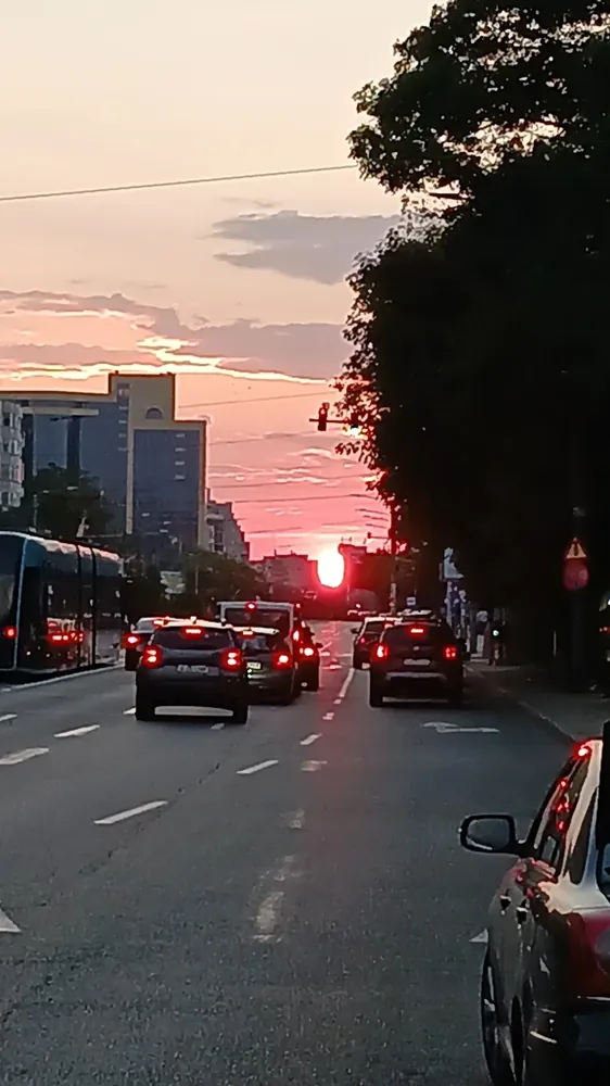 Sunset straight down the boulevard, tram on the left