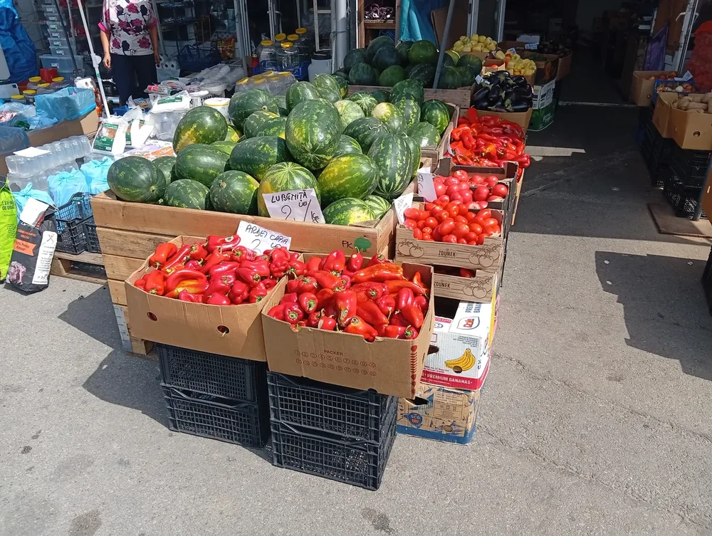 Watermelons, peppers and tomatoes sold off crates in the yard outside