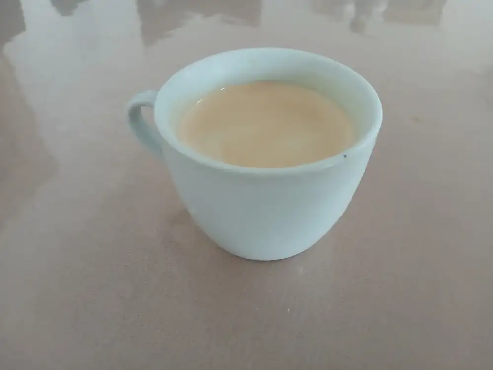 Coffee, in a plain white cup