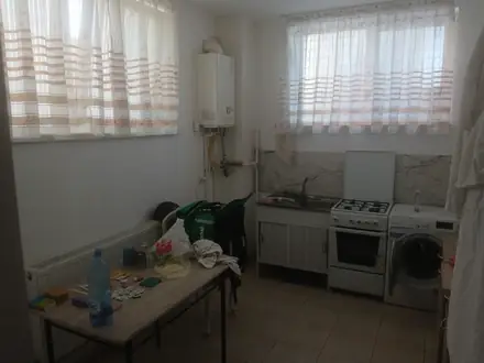 A souterrain kitchen: the windows start at head height because the pavement is at head height